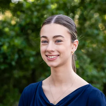 A smiling IntegratePHYSIO clinician