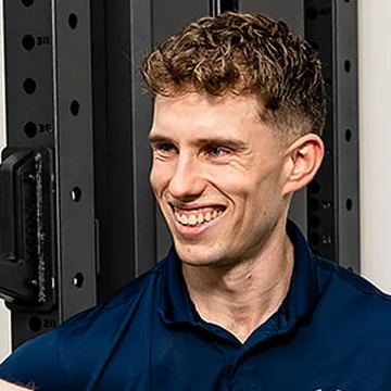 A smiling IntegratePHYSIO clinician